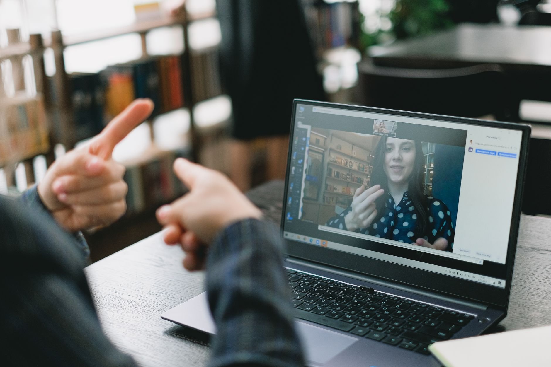 Instructor teaching CPR techniques during a live video call