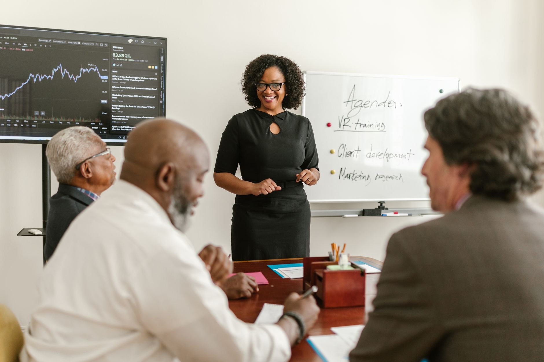 Professionals engaged in a live training session, discussing plans together
